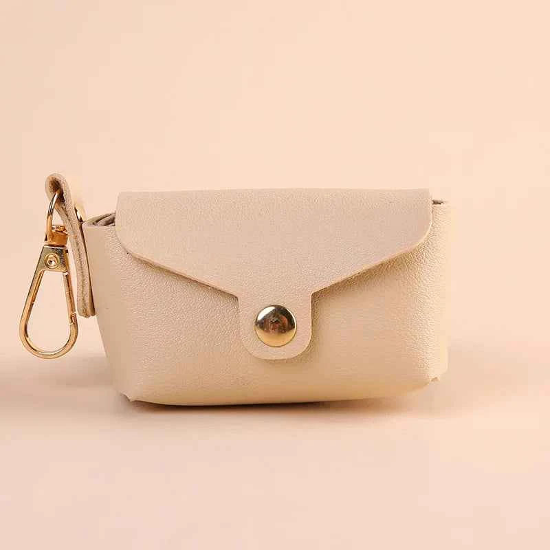 Portable Dog Waste Bag Dispenser – Durable Polyester Poop Bag Holder with Convenient Leather Clip for Easy Outdoor Walks.