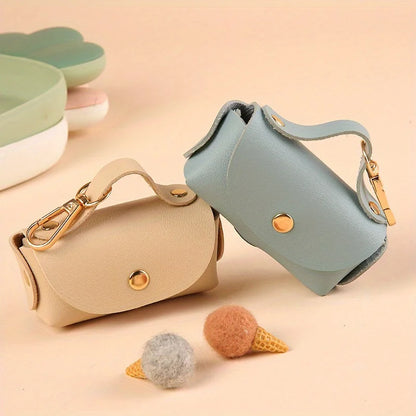 Portable Dog Waste Bag Dispenser – Durable Polyester Poop Bag Holder with Convenient Leather Clip for Easy Outdoor Walks.