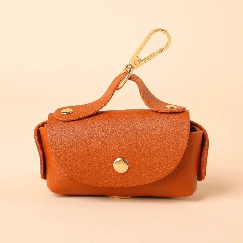 Portable Dog Waste Bag Dispenser – Durable Polyester Poop Bag Holder with Convenient Leather Clip for Easy Outdoor Walks.