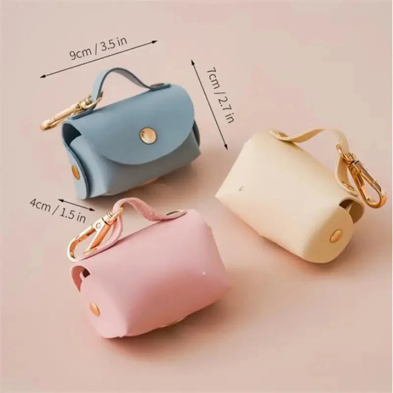 Portable Dog Waste Bag Dispenser – Durable Polyester Poop Bag Holder with Convenient Leather Clip for Easy Outdoor Walks.