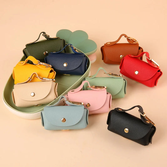 Portable Dog Waste Bag Dispenser – Durable Polyester Poop Bag Holder with Convenient Leather Clip for Easy Outdoor Walks.